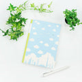 Frontia A5 notebook with pastel sky and Japan cityscape cover, featuring a soft, artistic design for note-taking and journaling.