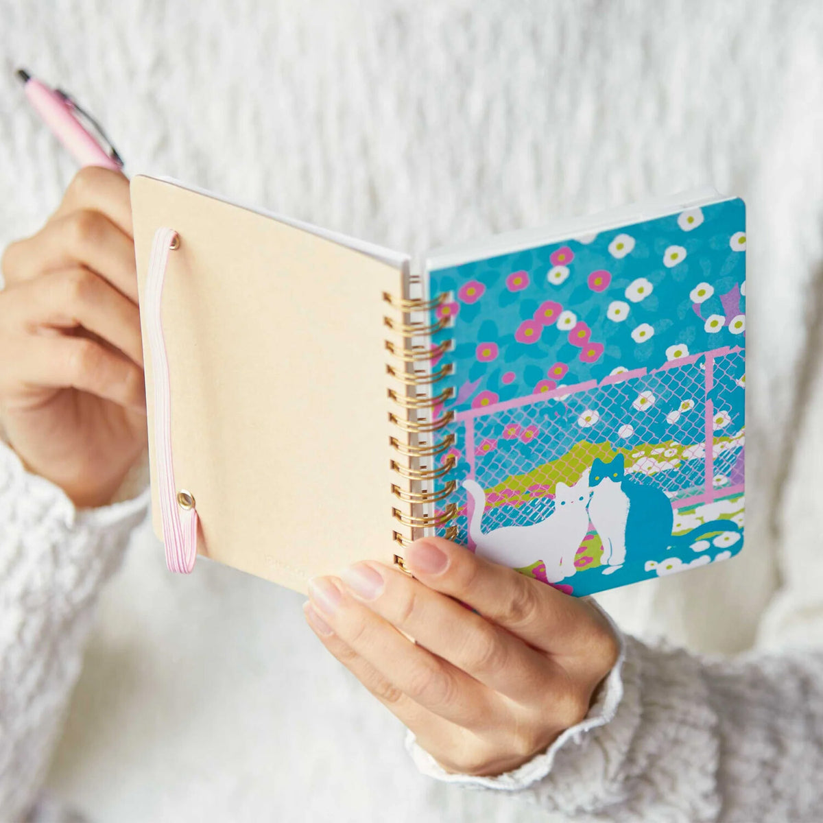 Cute cat and floral comic-style notebook with ring binding, ideal for journaling or note-taking, by Zoomy BUNGU.