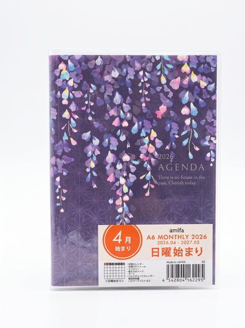 A6 monthly agenda planner by JapanoMono with a Wisteria cover featuring pages for April 2026 to May 2027, stationery organizer.