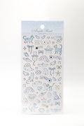 Pastel celestial stickers featuring winged cats, ribbons, and shooting stars from JapanoMono, ideal for decorating notebooks or planners.