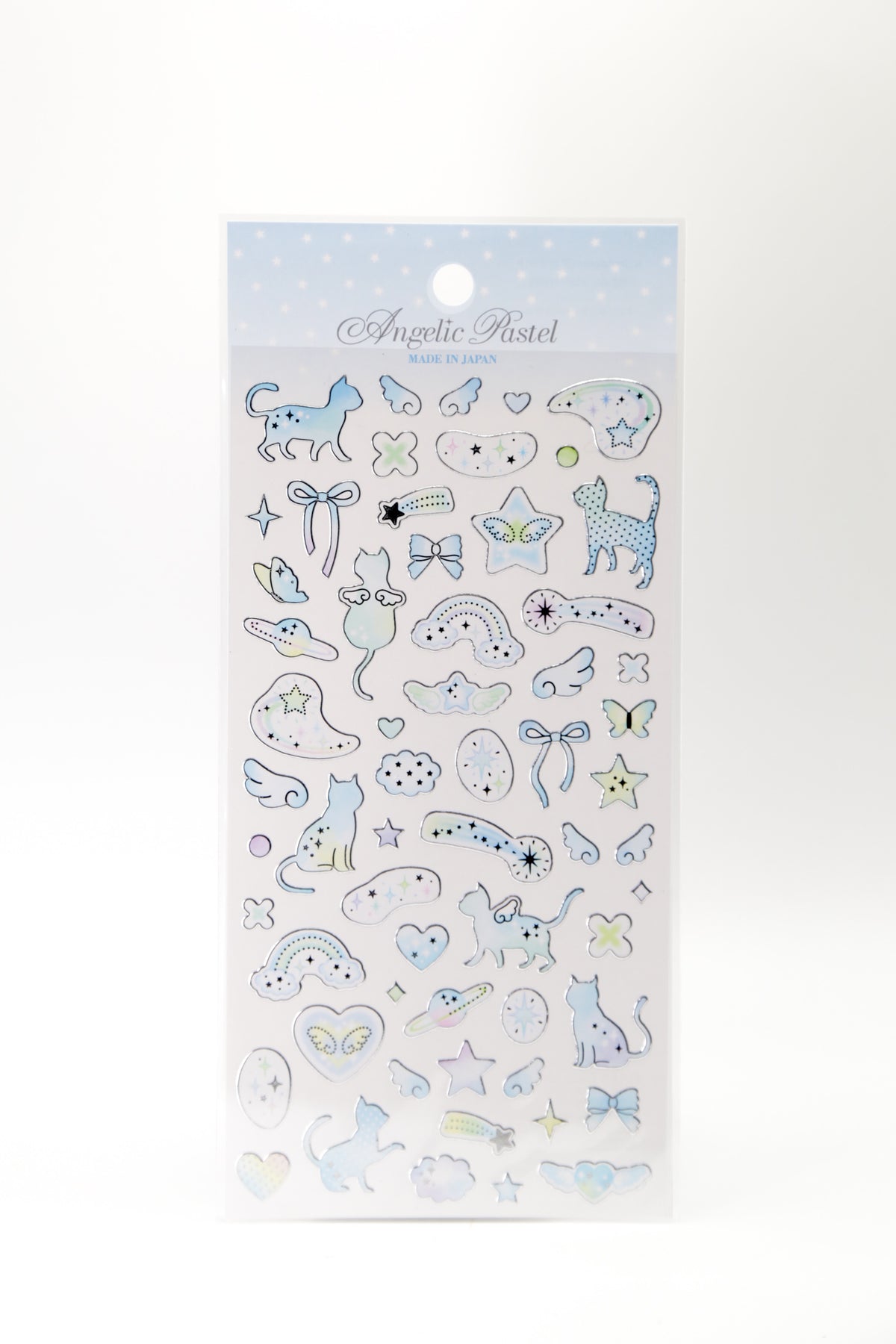 Pastel celestial stickers featuring winged cats, ribbons, and shooting stars from JapanoMono, ideal for decorating notebooks or planners.