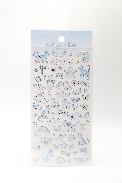 Pastel celestial stickers featuring winged cats, ribbons, and shooting stars from JapanoMono, ideal for decorating notebooks or planners.