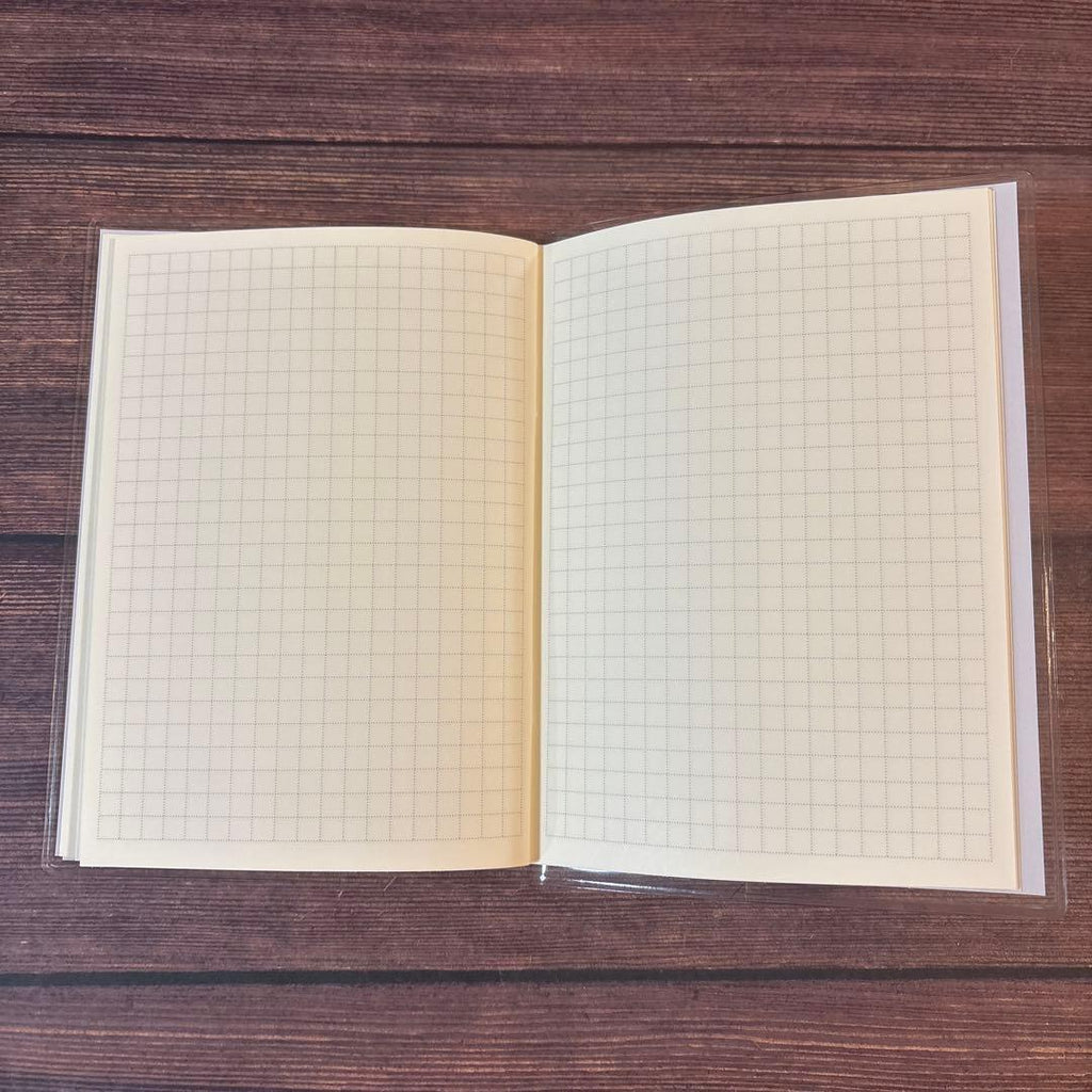 A6 Monthly Agenda Planner by JapanoMono in Wisteria cover, showing pages for April 2026 to May 2027 with floral design.