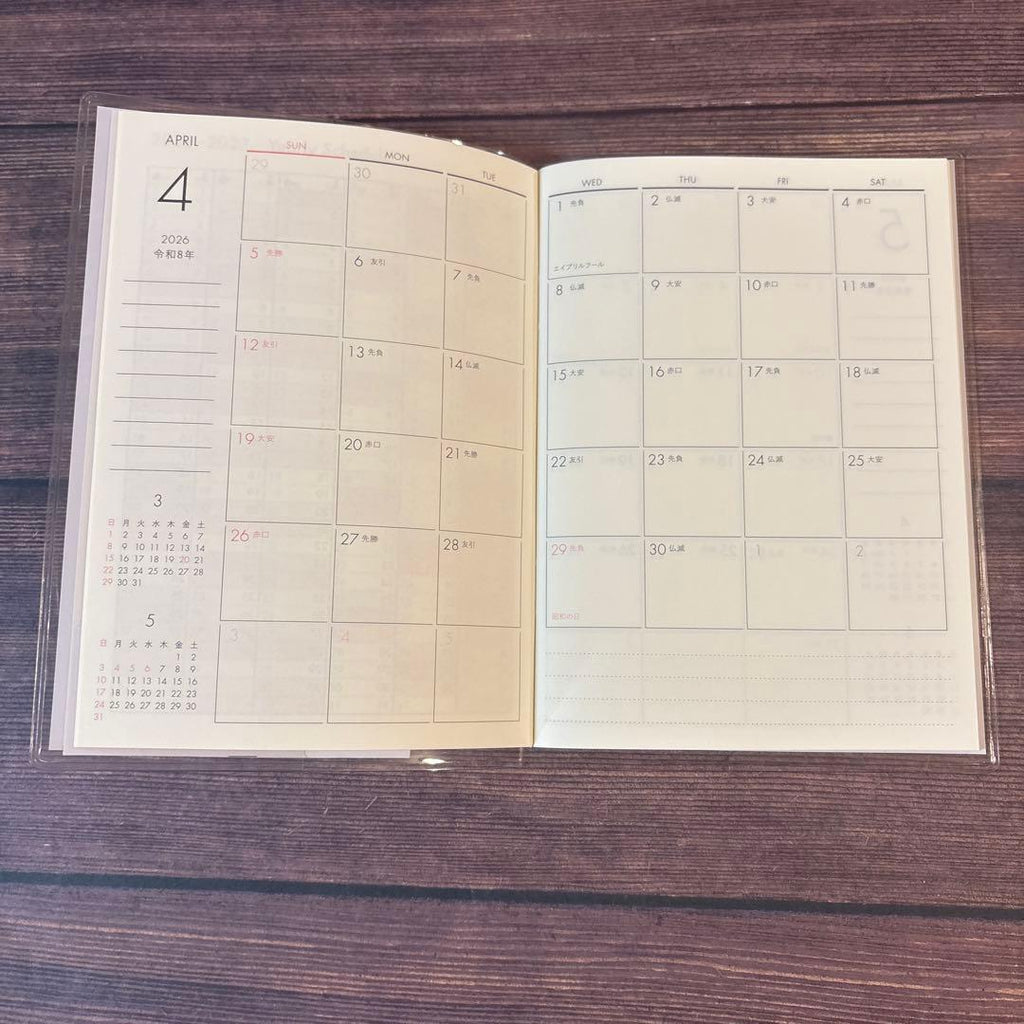 A6 Monthly Agenda Planner by JapanoMono featuring a soft wisteria-colored cover for 2026-2027.