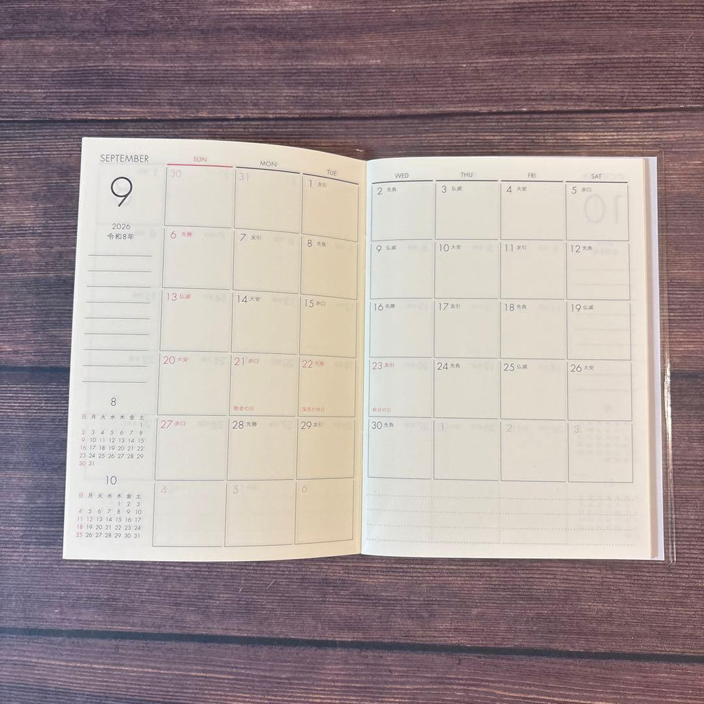 A6 Monthly Agenda Planner by JapanoMono with a wisteria floral cover and grid layout for April 2026 to May 2027.