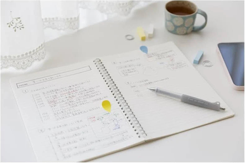 JapanoMono Pilot Doctor Grip Classic 0.5mm mechanical pencil in ice white, showing the ergonomic grip and sleek design.